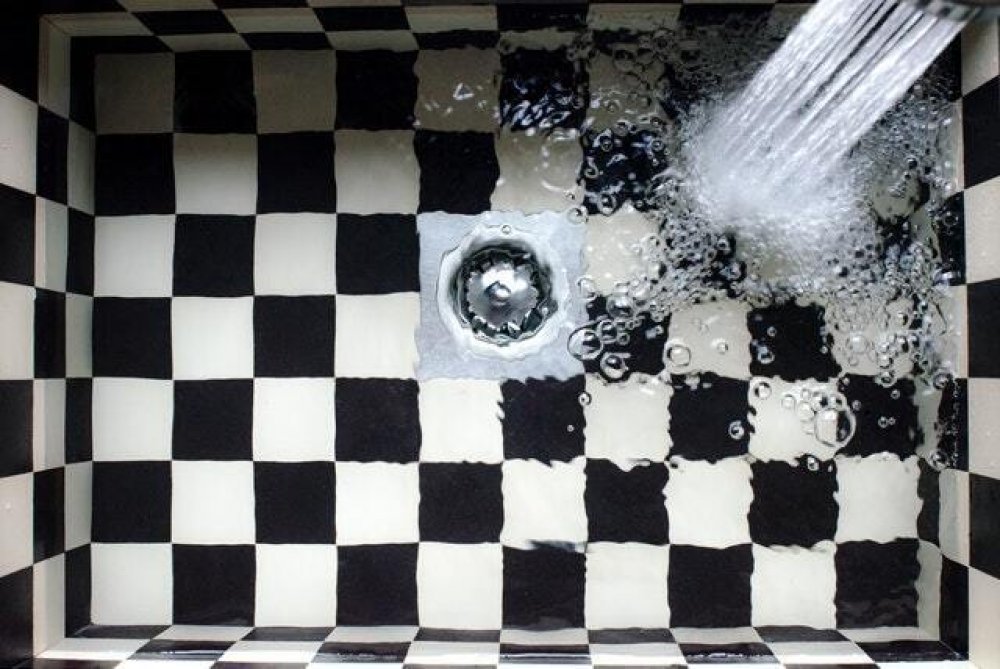 water going into a checkered sink